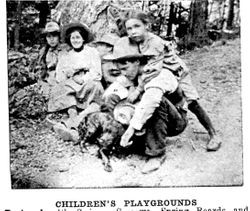 Children at the Camp Meeker playgrounds, equipped with swings, seesaws, spring boards and merry-go-rounds near the Russian River