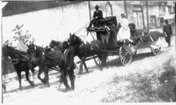 1912 Gravenstein Apple Show display of four horses pulling decorated wagon with driver and girl in back