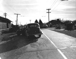 Scene of a car accident looking South on Gravenstein Highway (116) at the intersection of Sparkes Road, 1930s