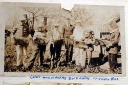 Oscar A. Hallberg, 4H leader, demonstrating beekeeping in Santa Rosa to with a group of boys about 1925