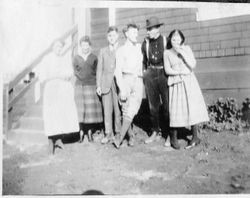 Karl Asman and five unidentified men and women stand in front of the Asman house at Bodega Bay, about 1919