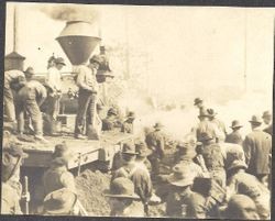 Men surround a California Northwestern (CNW) engine during the Battle of Sebastopol Avenue, March 1, 1905 between the electric Petaluma & Santa Rosa Railway and the steam California Northwestern (CNW) railroad right-of-way