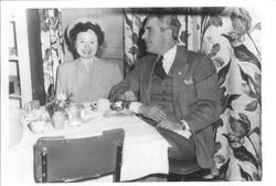 Bunni and George Streckfus at dinner table or restaurant in 1949