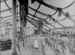 Gravenstein Apple Show display of a Ferris wheel made of whole and sliced apples and the Standard Oil "Flamo" display, 1930s