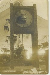 1913 Gravenstein Apple Show display of a pendulum clock made of whole and dried apples