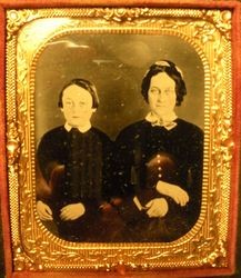 Young boy and woman who are unidentified members of the Swain family of Sebastopol, 1850s