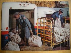 Loading Relay Trucks photo poster used as school teaching guide from the Society for Visual Education, 1965