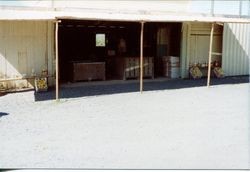 Apple juice and apples in front of Don and Marcia Hallberg's fruit stand at 2500 Gravenstein Highway North, Sebastopol, California, 1975