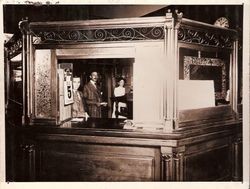 Walter Monroe, George E. Baxter and an unidentified woman in the First National Bank in Sebastopol located on the south east corner of Main Street and Santa Rosa Avenue in 1904 or 1905