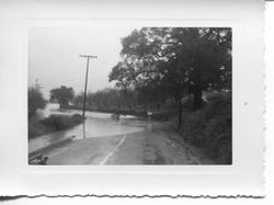 1951 floodwaters cover Occidental Road at the High School Road intersection