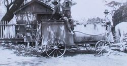 John and Oscar Hallberg with the Hallberg spray rig used to spray apple orchards for insects