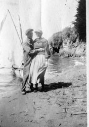 Karl and Alice Asman in front of a small sailboat at Bodega Bay, about 1918