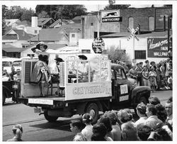 Float for "Centennial Bar" on the back of a pickup truck in the 1950 California Centennial parade in downtown Sebastopol, California