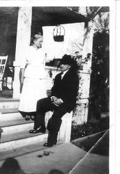 Mr. And Mrs. Chester Myers on the steps of a house--probably the house of their son Chester R. Myers in Sebastopol