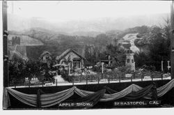 Circa 1912 Gravenstein Apple Show, display of a diorama of a stone house with tile roof