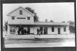 Group of men and women standing outside the Independent Order of Good Templars (IOGT) building and Post Office in Sebastopol, California, about 1897