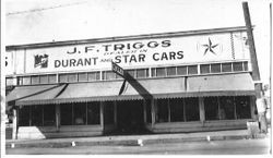 Store front of J. F. Triggs auto parts and cyclery, Dealer in Durant and Star cars, located at the southwest corner of South Main Street and Burnett Street, (200 South Main) Sebastopol, about mid-1920s