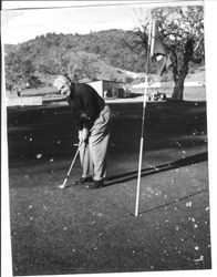 George Streckfus golfing at an unknown course, 1950s