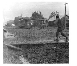 Railroad crew digging out the rails along Main Street, Sebastopol after a rain, 1910