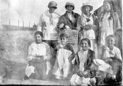 Group of eight girls, probably the birthday party group with Blanche Riddell, 1916