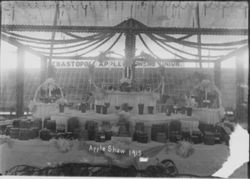 Gravenstein Apple Show exhibit, about 1915 in Sebastopol, showing display at Apple Show with Sebastopol apple Growers Union sign in rear