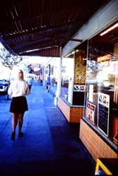 Newmeyer's Bakery and other business along North Main Street, from the sidewalk in front of the Pine Cone Restaurant, Sebastopol, California, 1970