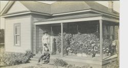 Unidentified man and women with a dog on a west Sonoma County house, about late 1800s or early 1900s