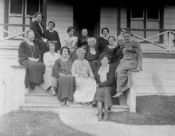 Large group of adult women posing for a photo on the front steps of a house, possibly the Borba family, 1920s