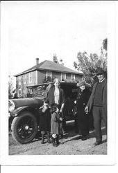 Rosebrook family picture in front of a car and two story house, fall 1923