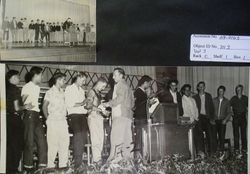 Unidentified students being congratulated by Walt Foster, head coach at the 1953 Analy High School athletics awards