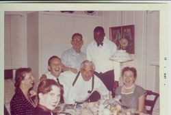 Bunni and George Streckfus and other people at dinner party, possibly New Year's party, January, 1961