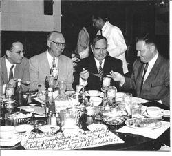 Congressmen Hubert B. Scudder, James Utt, Joe Martin and Joe Holt enjoying Hallberg (Redwood Empire brand) apple sauce and apple butter at the Capitol restaurant in Washington DC, 1954