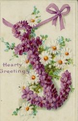 Picture of an anchor made of violets surrounded by daisies, postmarked 1913