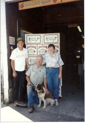 Eric, Tom and Pat Marshall stand in front of boxes of their Blossom Hill apples at the Marshall Ranch in Sebastopol, 1992