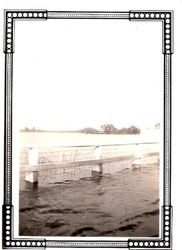 Flood waters over Cnopius Field (Sebastopol Airport) from Santa Rosa Avenue (Highway 12) near the Laguna de Santa Rosa in Sebastopol, California, 1940s