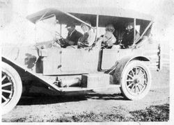 Cora Miller Elvy with the Riddell family in a about 1920 car