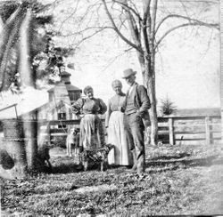 Mrs. A. J. (Ludencia) Peterson, her daughter Laura and an unidentified man at the Peterson farm in Santa Rosa, about 1908