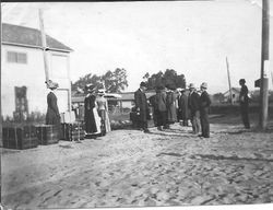 Graton passengers waiting for the P&SR electric train in Graton, California, as they travel to Santa Cruz to pack apples for Mitchell and Goodall of San Francisco, 1910