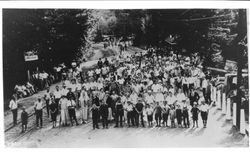 Large group of people posing for a picture on the Northwestern Pacific railroad tracks at a Russian River area resort, 1920s