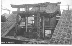 1911 Gravenstein Apple Show Japanese exhibit of the "Shrine of NA__KO" made of apples and boxes of apples on either side