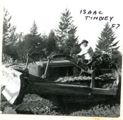 Isaac (Ike) Tinney on a bulldozer, 1957
