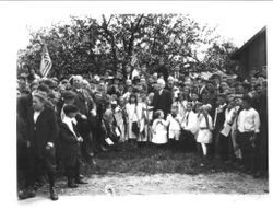 Luther Burbank, holding a young tree surrounded by a group of children celebrating Arbor Day in Santa Rosa, California, March 7, 1921