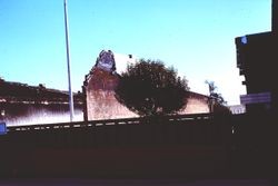 Unidentified brick wall remaining from demolished building, 1977