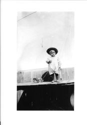 Two year old Delbert (Deb) E. Triggs with a toy wagon in 1911