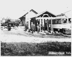 Russell's Auto Stage is parked in front of the Forestville P&SR railroad depot, about 1910