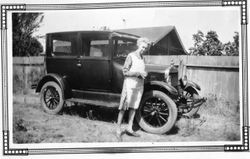 Mrs. F. J. (Eloise) Riddell in front of the Elvy car, about 1930