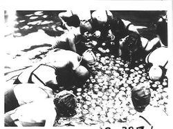 Girls in swimming suits and caps, bobbing for apples and the Gravenstein Apple Show, 1920s