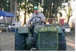 Tom Marshall of the Marshall Ranch in Sebastopol sits on his John Deer tractor at Ponte's Tractor Show, 2000s