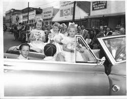 Sebastopol Apple Blossom Princesses in a car driven by Stan Janes of Stans Men's Store, about 1951