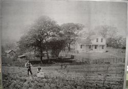 John and Neta Hallberg in front of their two-story farm house on Oak Grove Avenue in Graton